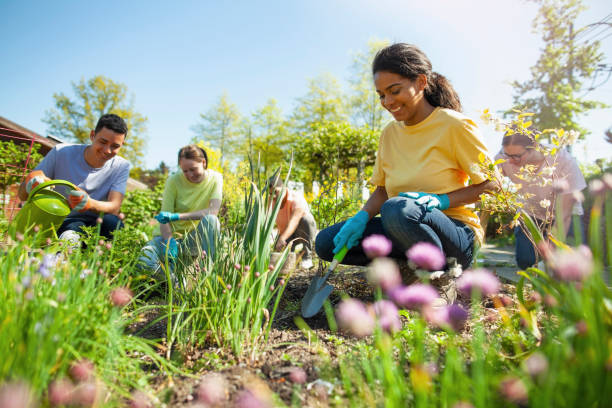 About Us Hero Image - Diverse group of people working together outdoors